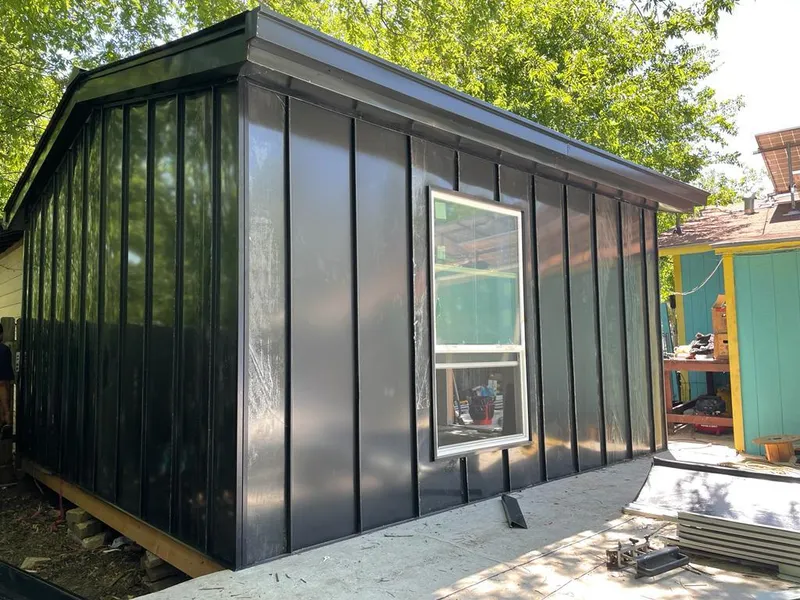 Black standing seam metal wall panels for Roof Inspection in Broadview