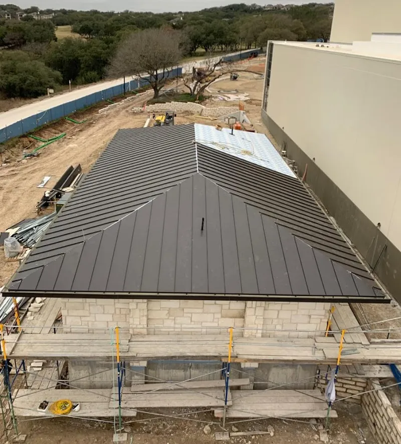 Metal roof new construction with scaffolding in Broadview